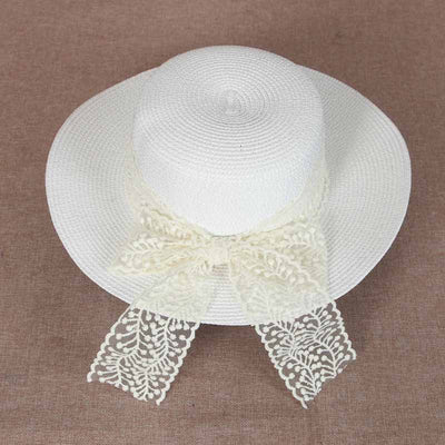 wholesale straw hats Cupcake shape decorated with white lace bow.ขายส่งหมวกสาน ทรงคัพเค้กตกแต่งด้วยโบว์ลูกไม้สีขาว ใส่แล้วสวย ดูดีฝุดๆ