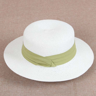 Cake-shaped straw hat with green headband. This green is the most garish, beautiful shape, is very popular. Suitable for wearing to the sea.หมวกสานทรงเค้ก คาดสีเขียว เขียวนี้จี๊ดสุด ทรงสวย เป็นที่นิยมมาก เหมาะสำหรับใส่ไปทะเล