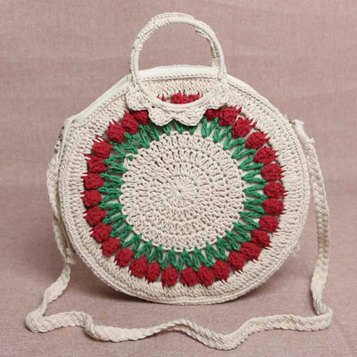 round woven bag Lining with drawstring The outside is decorated with lovely red flowers. Whether carried or carried over the shoulder, it looks chic..กระเป๋าสานทรงกลม บุผ้าซับในเป็นหูรูด ด้านนอกตกแต่งลายดอกไม้สีแดงน่ารัก จะถือหรือสะพายข้างก็ดูเก๋ๆ